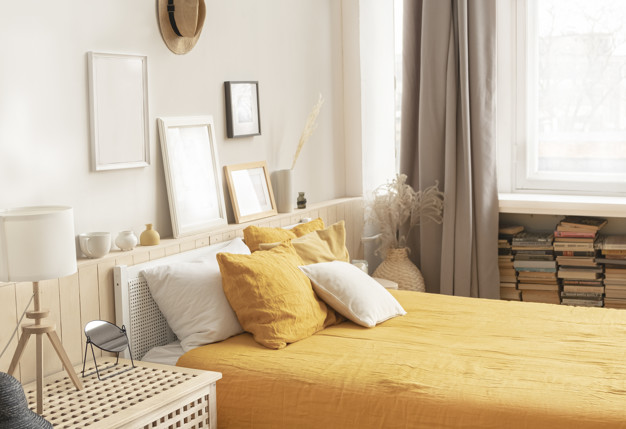 cozy-bright-bedroom-rustic-style-bed-with-bright-yellow-linens_129447-137